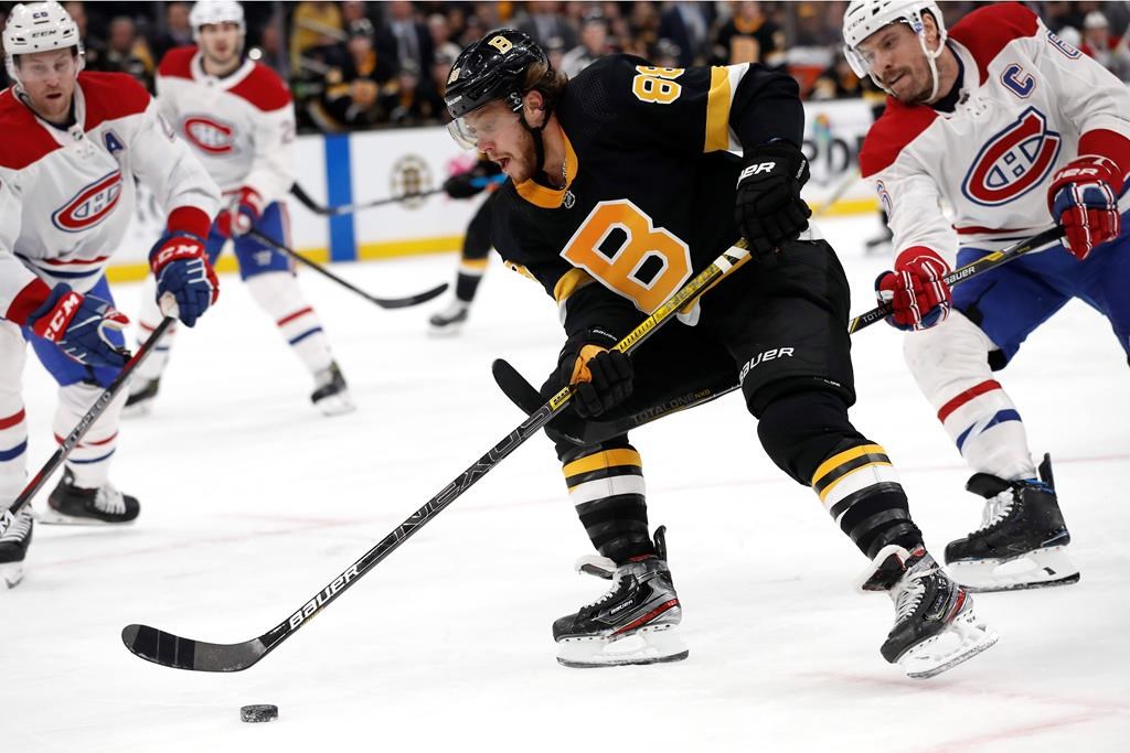 Boston Bruins' David Pastrnak goes around Montreal Canadiens defenceman Shea Weber on Sunday, Dec. 1, 2019, in Boston.
