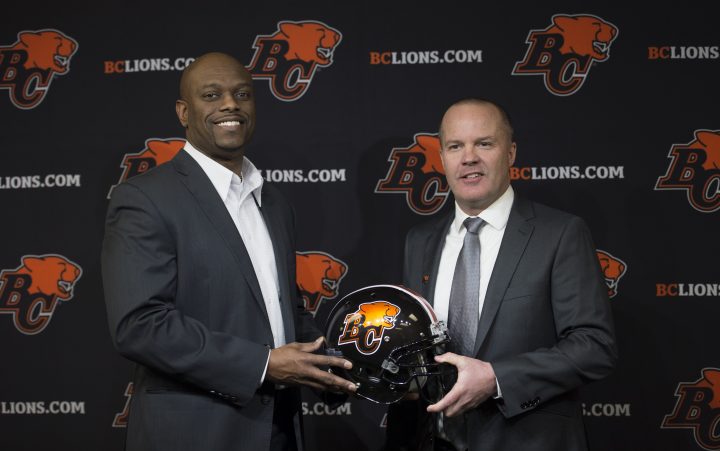 B.C. Lions general manager Ed Hervey, left, introduces the team's new head coach Rick Campbell during a news conference at the team training facility in Surrey, B.C., Monday, Dec. 2, 2019. 