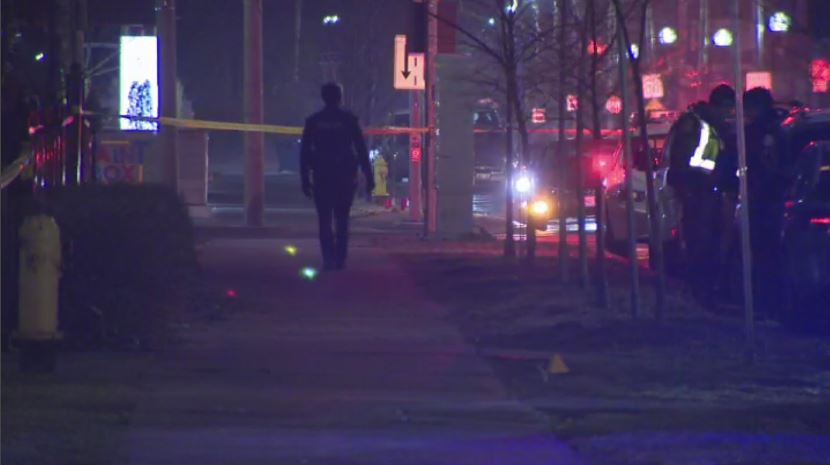 Police search for evidence after a shooting near Sackville Street and Dundas Street East.