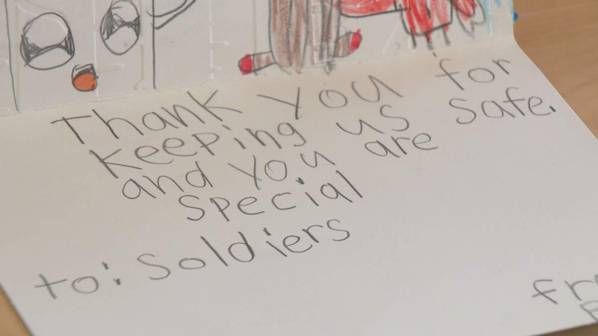 Students from Our Lady of Victories Catholic School in Edmonton make Christmas cards for Canadian Armed Forces.
