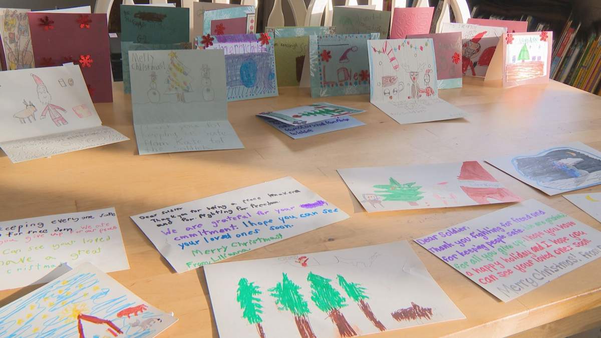 Students from Our Lady of Victories Catholic School in Edmonton make Christmas cards for Canadian Armed Forces.