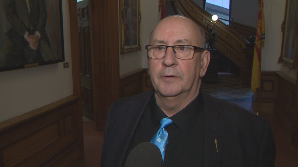 Carl Urquhart, New Brunswick's public safety minister, speaks to media in December 2019. 