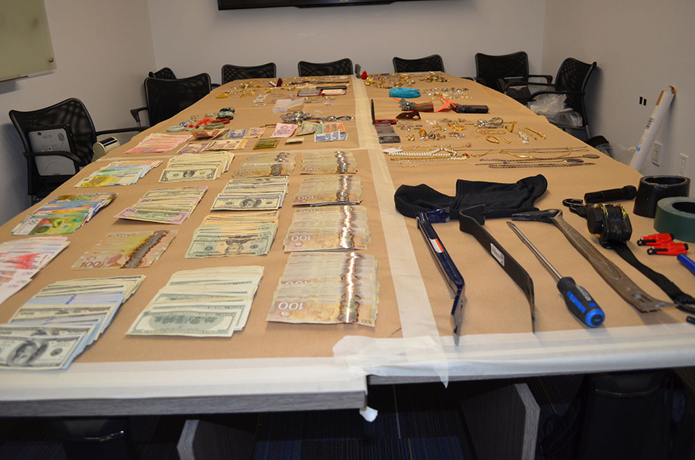 Cash, tools and jewelry police say they recovered when arresting an alleged prolific Port Coquitlam burglar. 