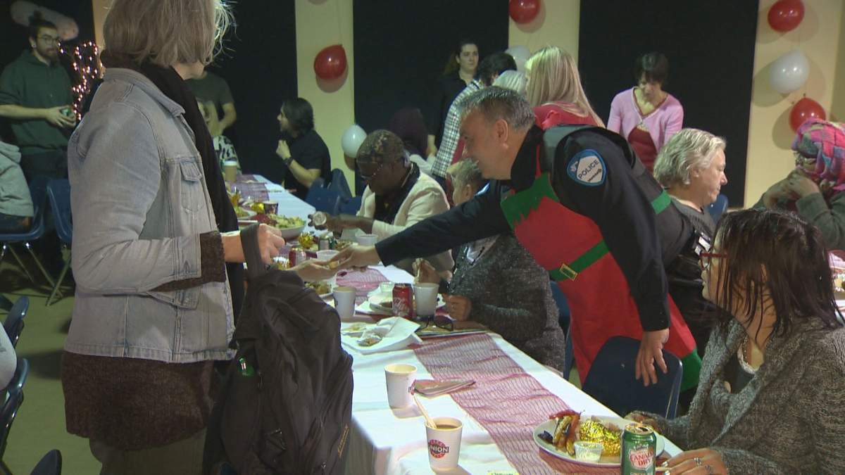Montreal police officers lent a helping hand during Chez Doris’ annual Christmas party on Tuesday.