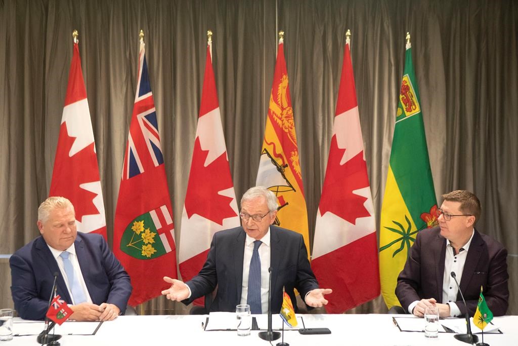 Ontario Premier Doug Ford, left to right, New Brunswick Premier Blaine Higgs and Saskatchewan Premier Scott Moe sit as they talk to the media in Toronto on Sunday, Dec. 1, 2019.