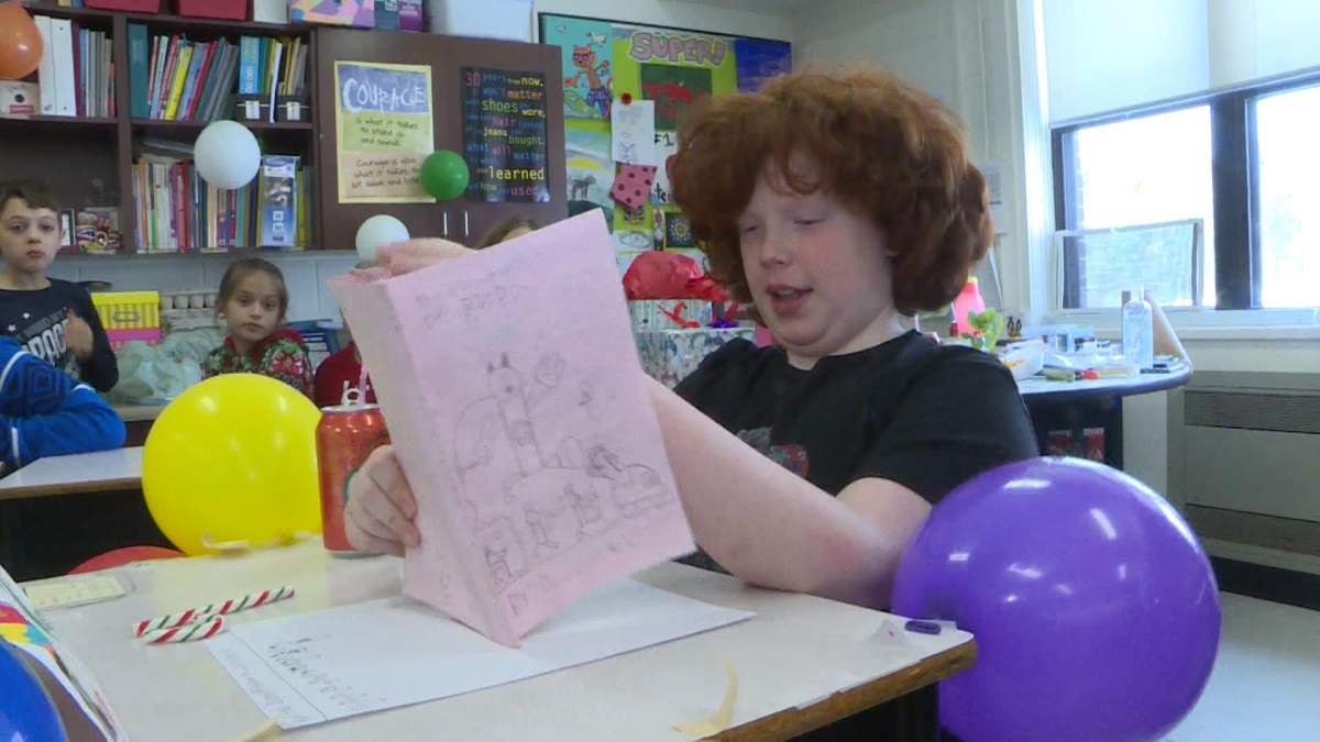 Dominick reads from his graphic novel The Adventures of BatDom.