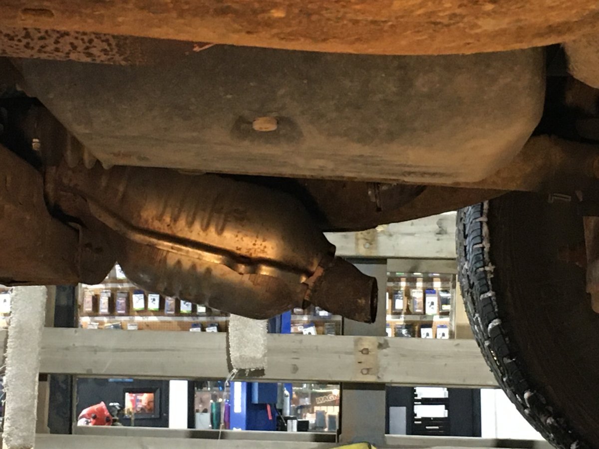 Thieves tried unsuccessfully to remove this catalytic converter off a truck, but did damage anyways by cutting the surrounding pipes.