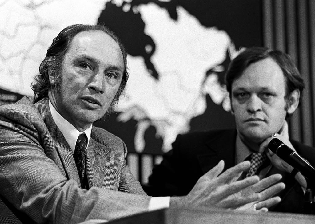 Prime Minister Pierre Trudeau speaks at a press conference in Ottawa on June 19, 1972. Beside him is Cabinet Minister Jean Chretien.