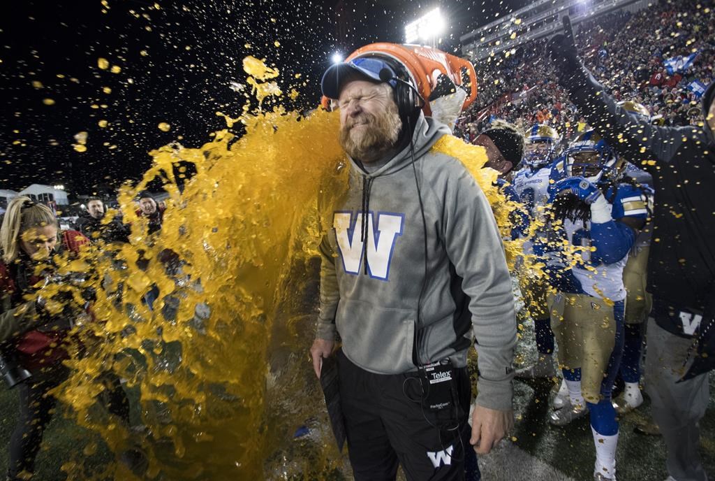 Winnipeg Blue Bombers head coach Mike O'Shea gets a sports drink poured over him as his team defeats the Hamilton Tiger Cats in the 107th Grey Cup in Calgary, Alta., Sunday, November 24, 2019. The Blue Bombers are rewarding general manager Kyle Walters and head coach O'Shea for helping the team win the Grey Cup last month.THE CANADIAN PRESS/Frank Gunn.