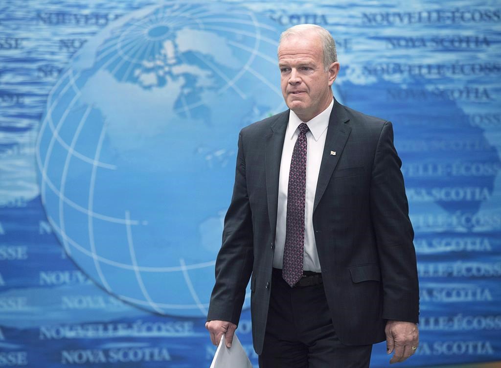 Justice Minister Mark Furey arrives at a news conference to provide details about cannabis legalization in Halifax on Thursday, Dec. 7, 2017.