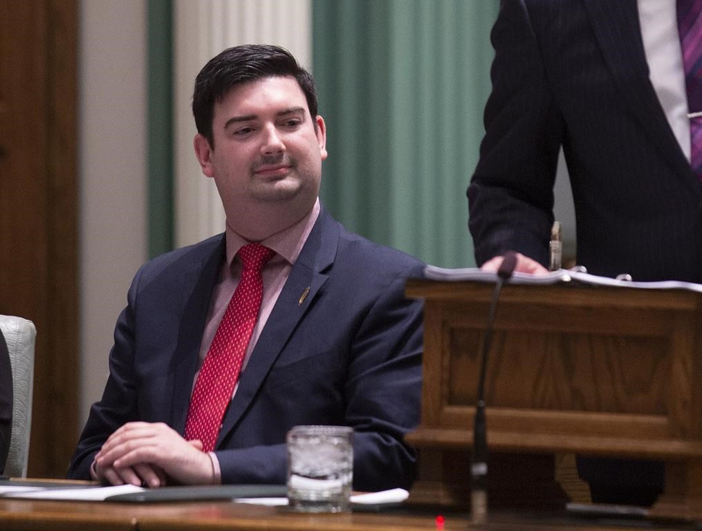 Christopher Mitchelmore, Minister of Tourism, Culture and Innovation listen as Finance Minister Tom Osborne presents the 2019 Budget in the House of Assembly in St. John's, Tuesday, April 16, 2019.