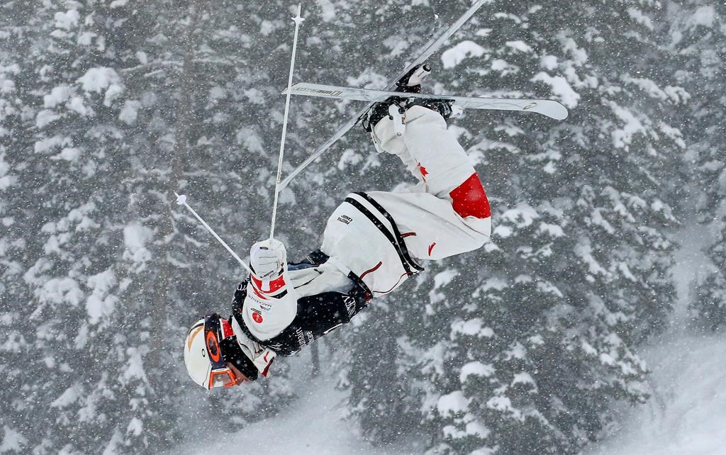 In this file photo, Mikael Kingsbury, of Canada, trains during the men's dual moguls skiing world championship, in Park City, Utah, Saturday, Feb. 9, 2019.