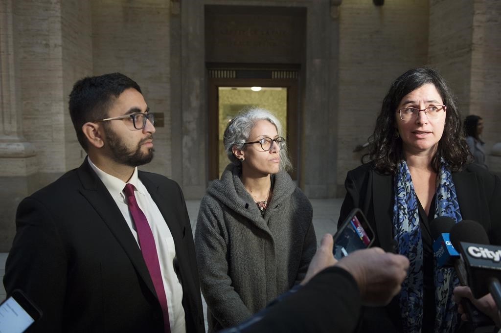 Members of the National Council of Muslims Mustafa Farooq, left, and Bochra Manai, centre, and Noa Mendelsohn Aviv a member of the Canadian Civil Liberties Association (CCLA) speak to reporters at the Quebec Court of Appeal in Montreal, Tuesday, Nov. 26, 2019.