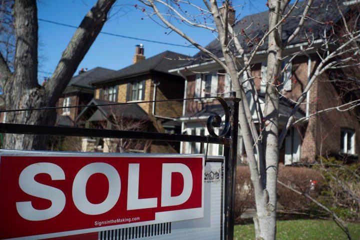 A sold sign is shown in front of west-end Toronto homes Sunday, April 9, 2017. 