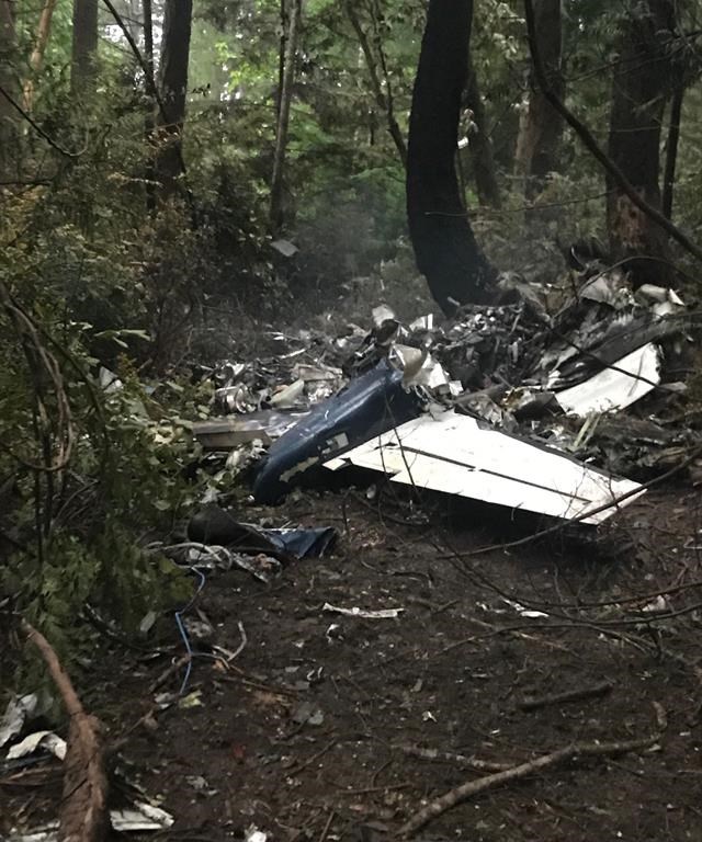 The scene of a small plane crash on Gabriola Island, B.C., is shown on Wednesday, Dec.11, 2019. A plane that one witness describes as crashing in a "huge explosion" that left multiple people dead in British Columbia has been identified as a twin-engine propeller aircraft.