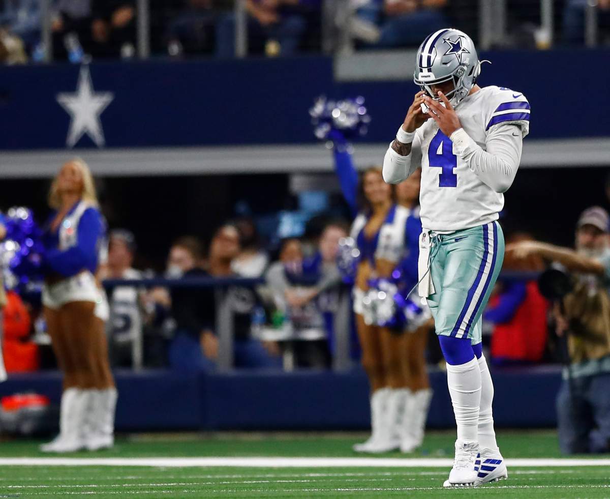 Dallas Cowboys quarterback Dak Prescott walks off the field against the Buffalo Bills at AT&T Stadium in Arlington, Texas, Nov. 28, 2019.