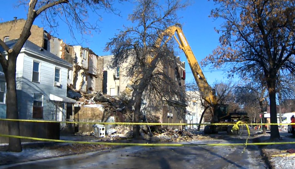 Demolition crews tore down the apartment block at 578 Agnes St. Friday after fire ripped through the building early Boxing Day.