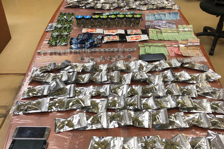 Police say they seized cash, 277 grams of edibles, 22 vape pens, 660 grams of pre-packaged cannabis, 64 grams of hashish and six grams of shatter.