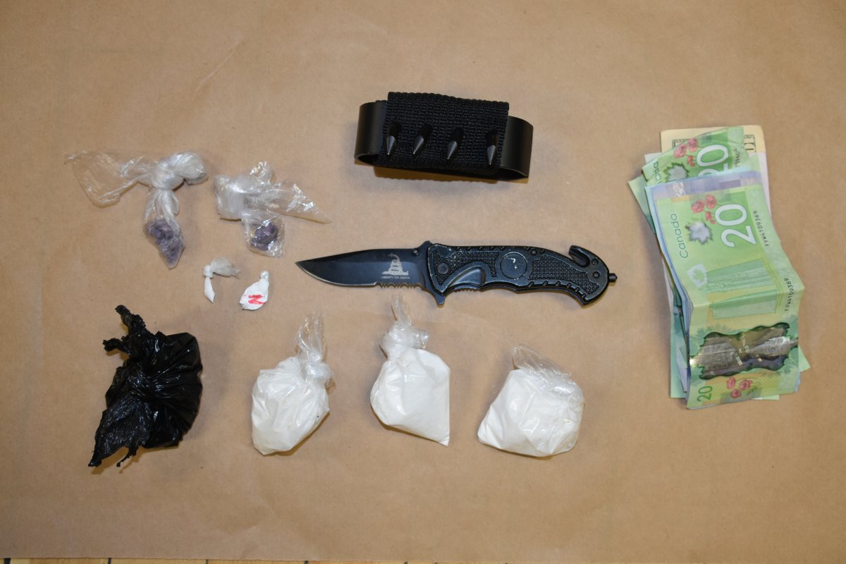 Cobourg and Port Hope police say officers seized drugs, weapons and cash from a Cobourg residence on Tuesday.