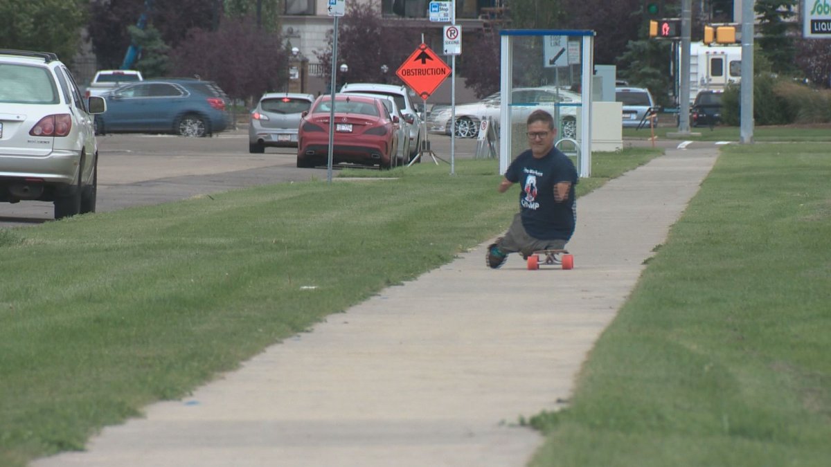 Chris Koch, born with no arms or legs, rode his long board in a marathon in Edmonton. 