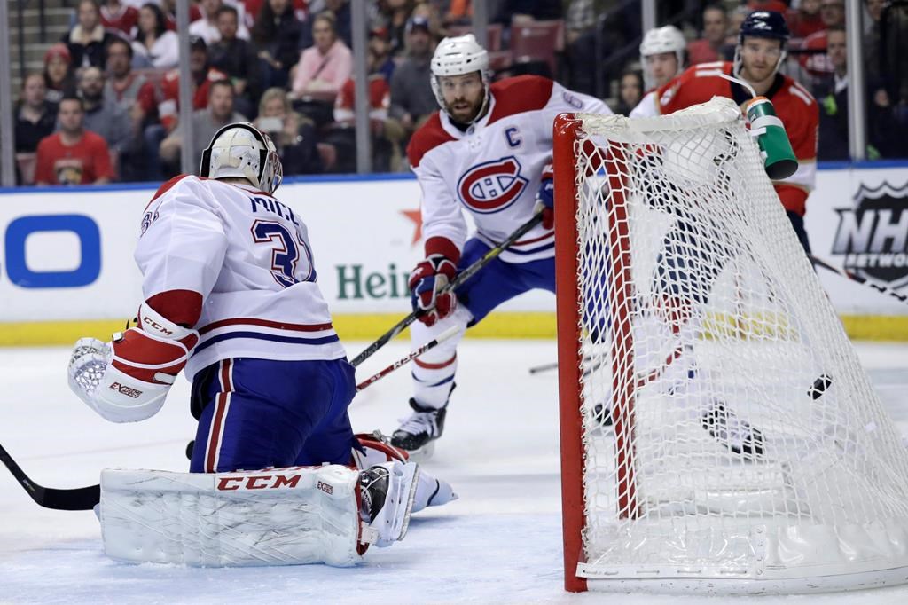 The puck gets past Montreal Canadiens goaltender Carey Price as Florida Panthers center Aleksander Barkov scores during the first period Sunday, Dec. 29.