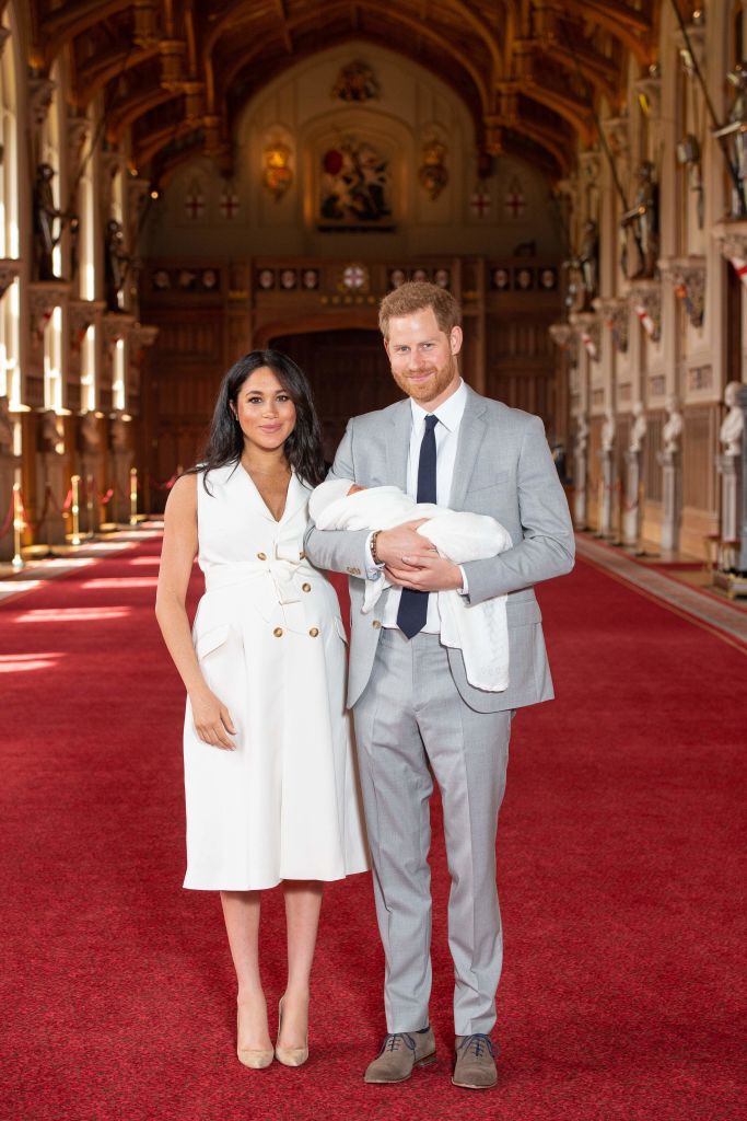 Britain’s Prince Harry, Duke of Sussex (R), and his wife Meghan, Duchess of Sussex, pose for a photo with their newborn baby son, Archie Harrison Mountbatten-Windsor, in St George’s Hall at Windsor Castle in Windsor, west of London on May 8, 2019. Photo: Getty Images