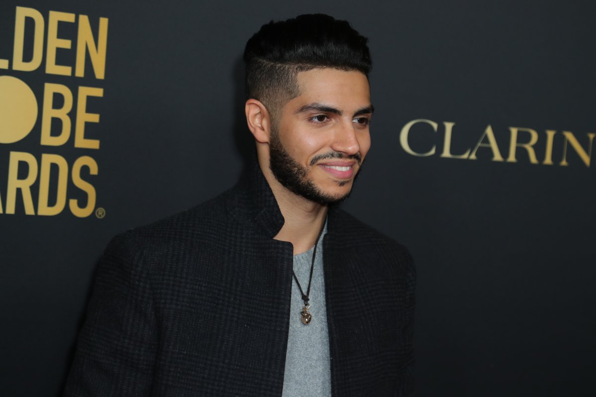 Mena Massoud attends HFPA And THR Golden Globe Ambassador Party at Catch LA on November 14, 2019 in West Hollywood, Calif.