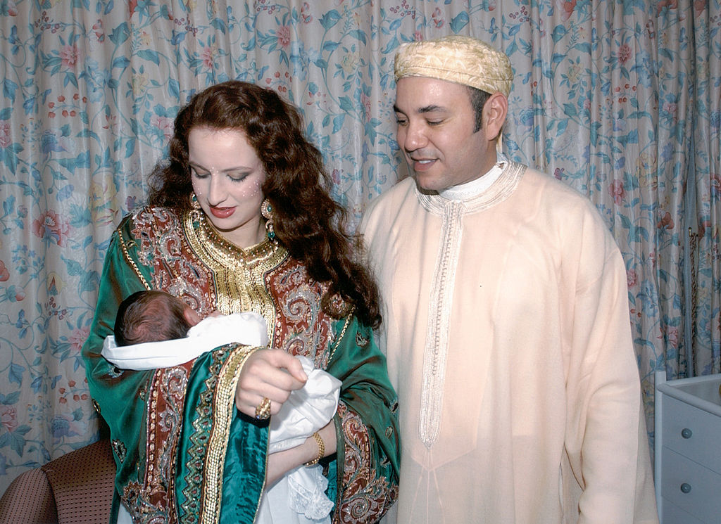 This handout photo by the Moroccan Royal Palace shows Moroccan Princess Laila Salma holding her son, Moulay Al Hassan, as King Mohammed VI of Morocco looks on on May 15, 2003 in Rabat, Morocco. King Mohammed VI, 39, ascended the throne in 1999 following the death of his father, who had ruled for 38 years.