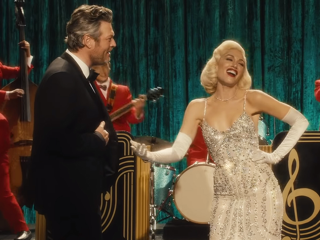 (L-R) Blake Shelton and Gwen Stefani in the 'You Make it Feel Like Christmas' music video. 2017.