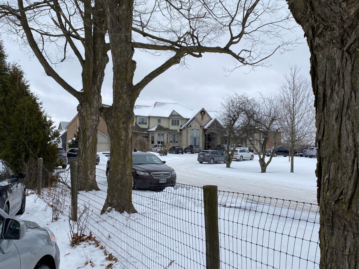A police raid at a mansion on Mount Nemo Crescent in Burlington on Friday was connected to the arrest of a man on human-trafficking charges.
