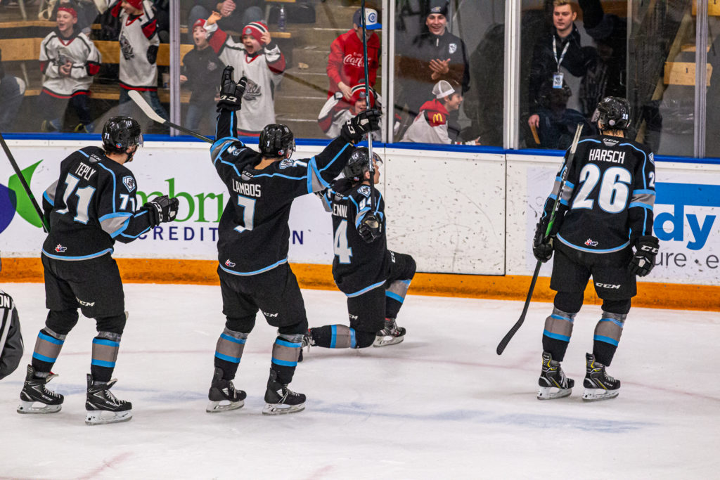 Winnipeg ICE players Michal Teply, Carson Lambos, Connor McCLennon and Reece Harsch celebrate a goal. Photo Credit/Zachary Peters .