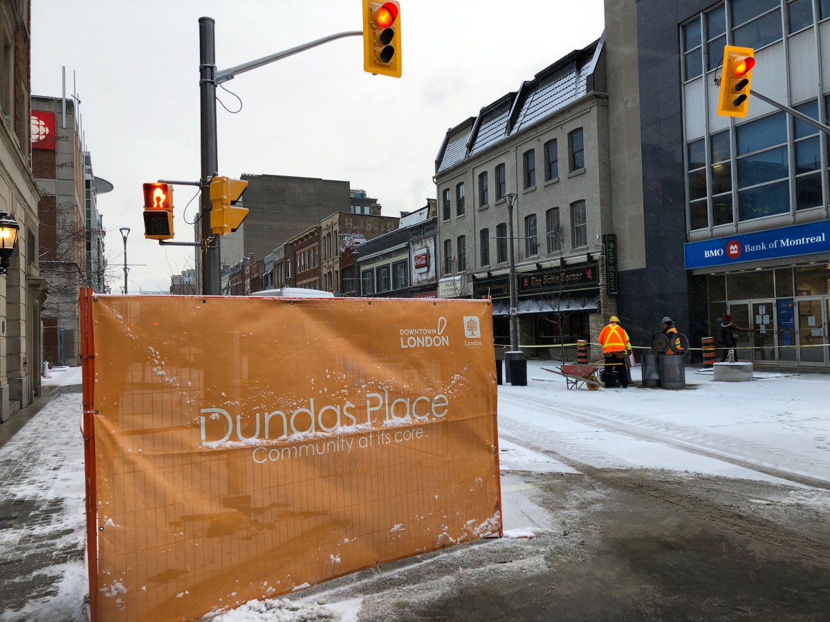 Construction crews on Dundas Place work through a burst of winter weather.