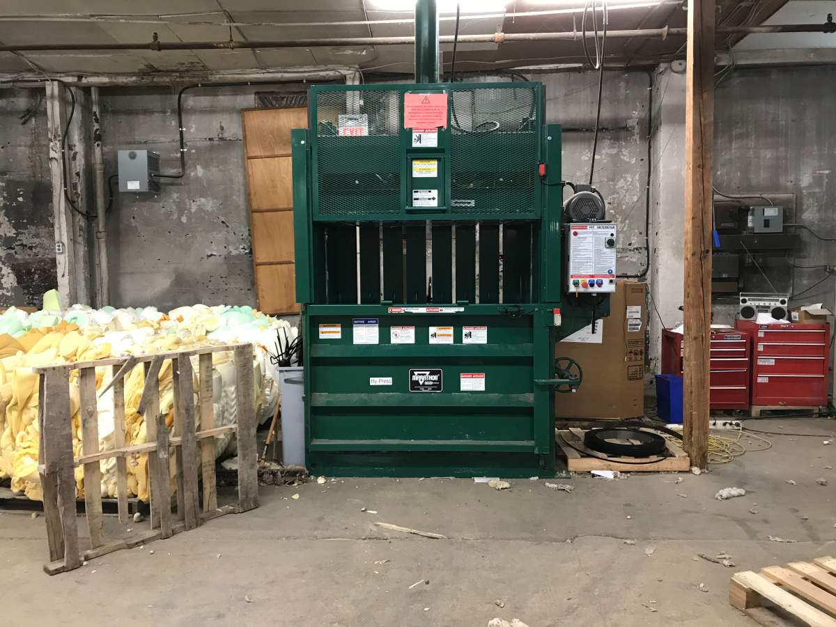 A bailer packages waste that's sent to the landfill, which only consists of five per cent of the mattress.