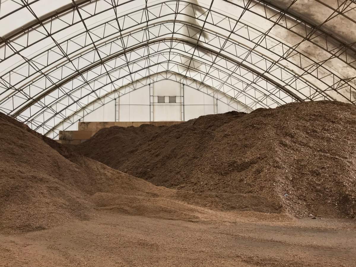 Inside a five-storey warehouse that keeps mounds of biofuel dry.