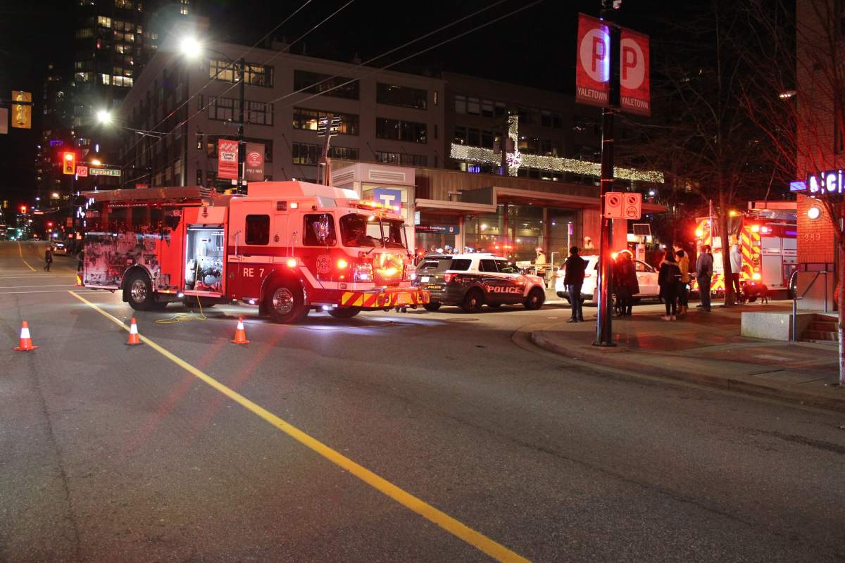 First responders work to rescue a man who fell down an elevator shaft at the Yaletown-Roundhouse Canada Line station. 