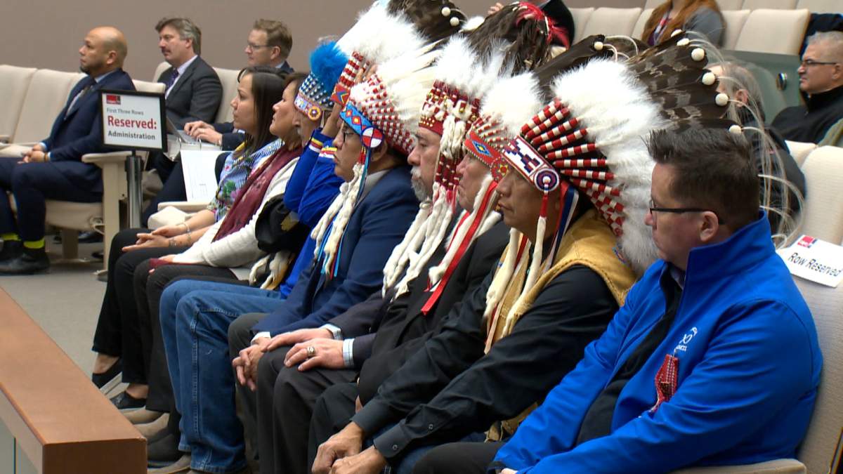 First Nations Chiefs in attendance at a Calgary city council meeting permanently raising flags of all member nations of Treaty 7 and the Métis Nation of Alberta Region 3.