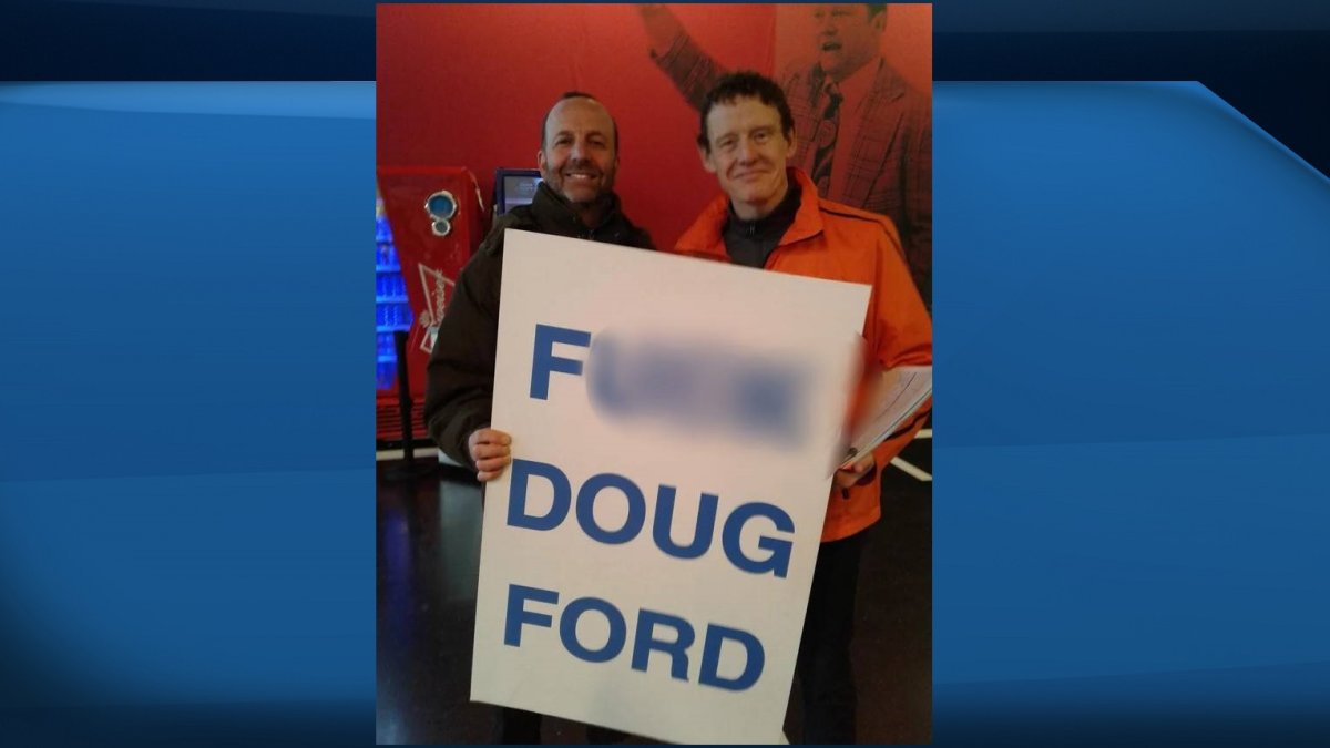 In a photo taken in Ottawa, MPP Joel Harden is seen posing with a man holding a vulgar anti-Ford sign.