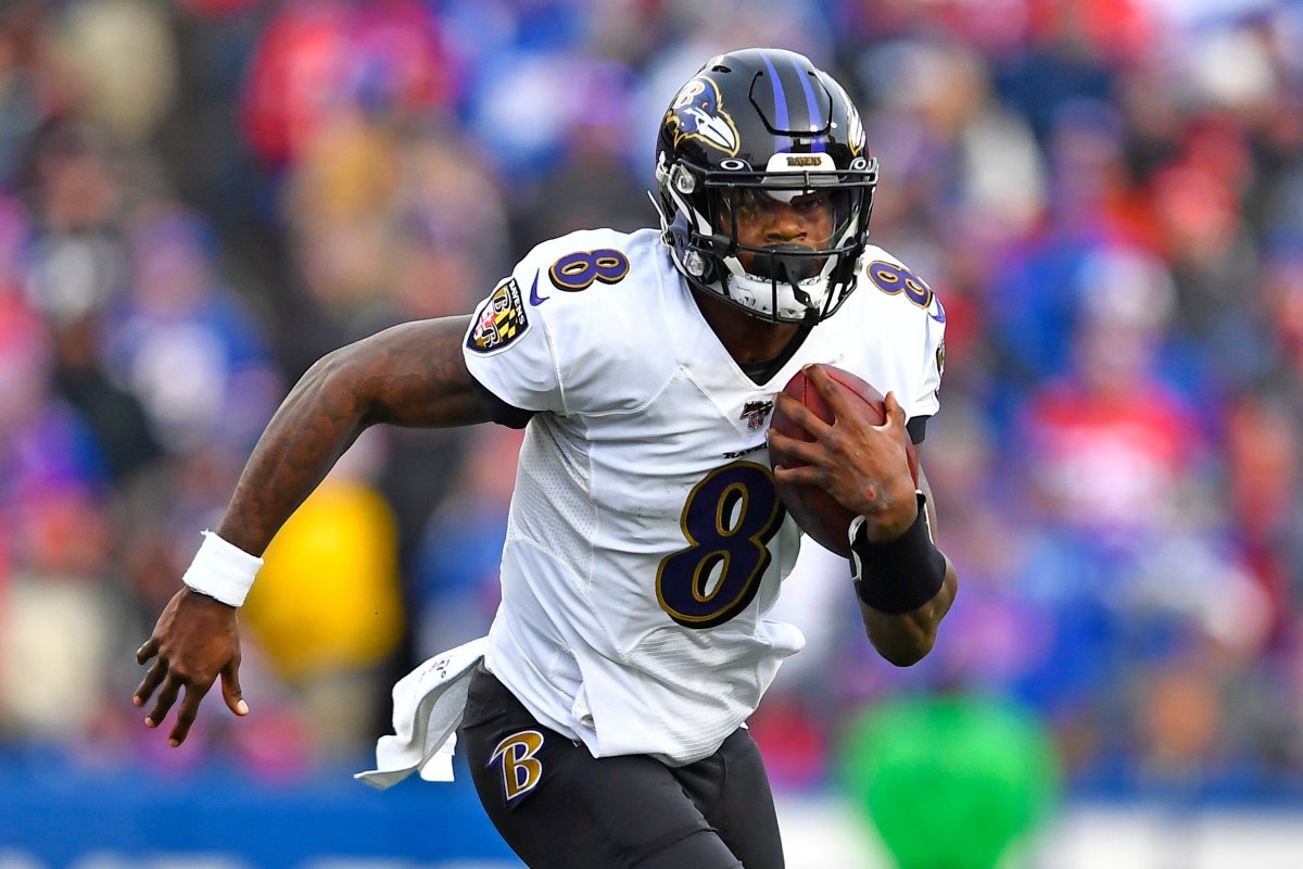 Baltimore Ravens quarterback Lamar Jackson (8) carries the ball during the second half of an NFL football game against the Buffalo Bills in Orchard Park, N.Y., Sunday, Dec. 8, 2019.