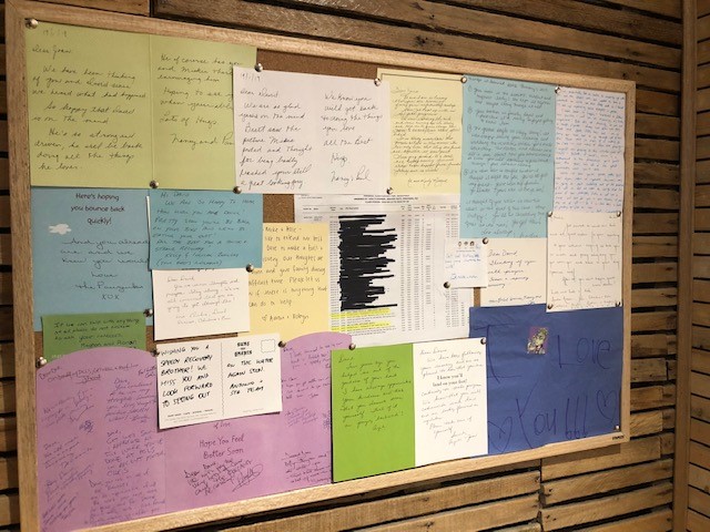 Well wishes line a bulletin board for David Shellnutt.