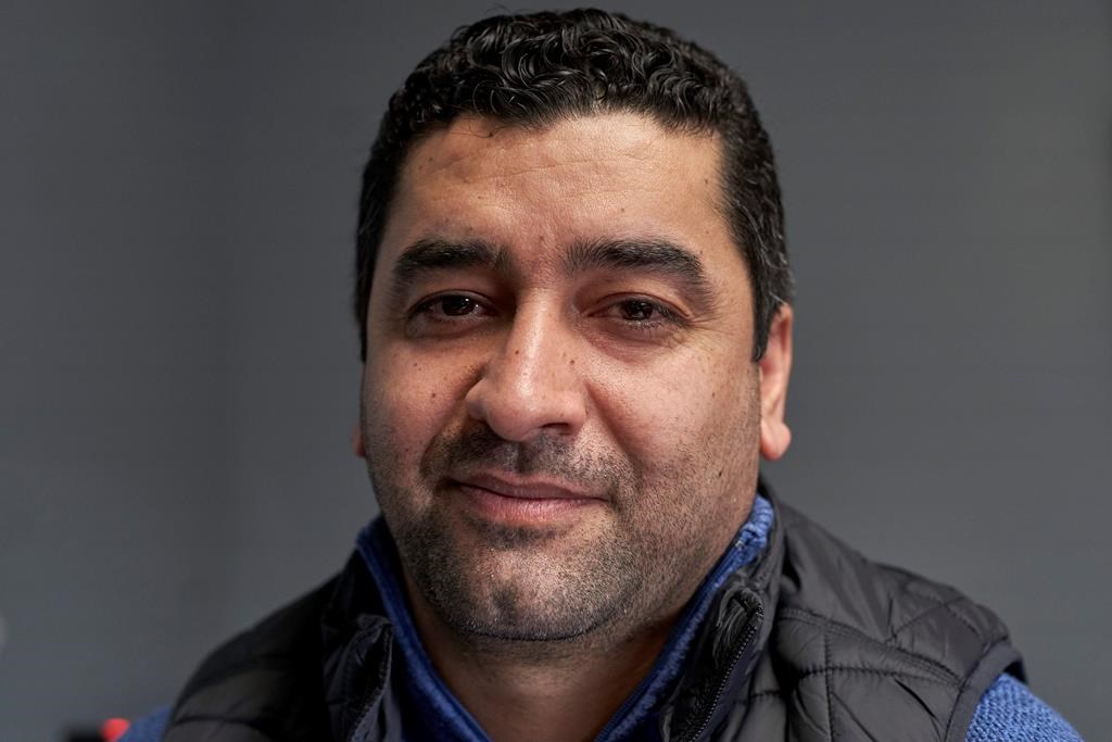 In this Dec. 19, 2019 photo, Hatim Ido poses for a photo in Lincoln, Neb., following an interview with the Associated Press.