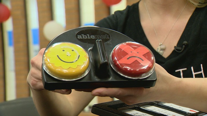 Brittany McGeough displays one type of assistive technology used in an annual holiday play created and performed by students who are non-verbal