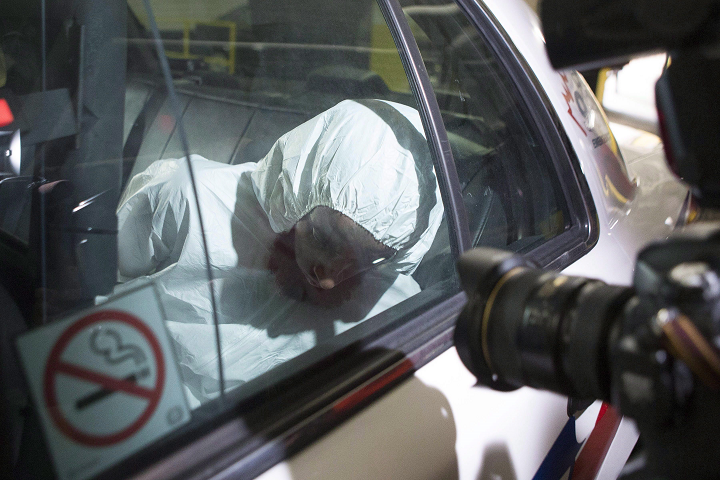 Ayanle Hassan Ali arrives in a police car at a Toronto court house on Tuesday, March 15, 2016.