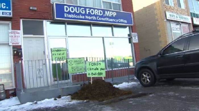 A group of climate activists dumped a pile of manure at Premier Ford's office in Etobicoke on Dec. 22.