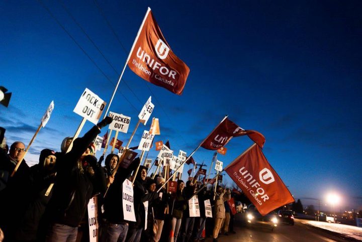 Members of Unifor Local 594 hold signs during a rally outside the Co-op Refinery in Regina on Thursday December 5, 2019.