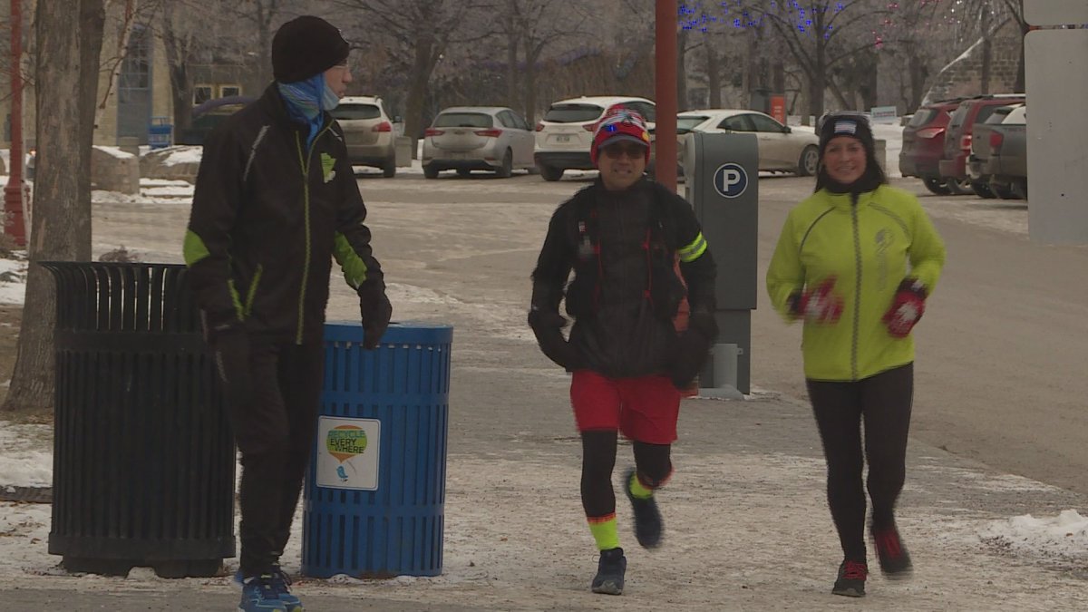 Junel Malapad (middle) is running 100 kilometres on Boxing Day to raise money for Siloam Mission. 