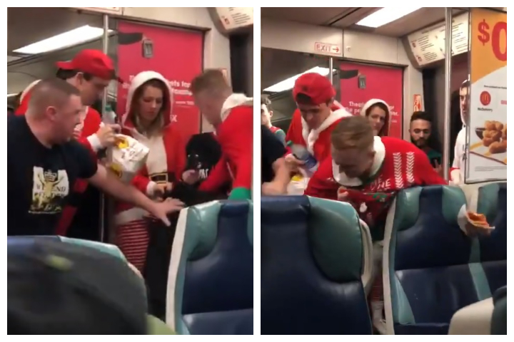 A stabbing suspect, in black, is shown in a fight with SantaCon attendees on an LIRR train in New York City on Saturday, Dec. 14, 2019.