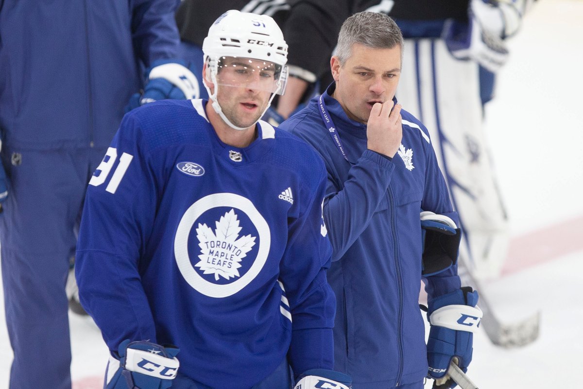 Toronto Maple Leafs head coach Sheldon Keefe, right, talks to captain John Tavares at practice on Monday, November 25, 2019.