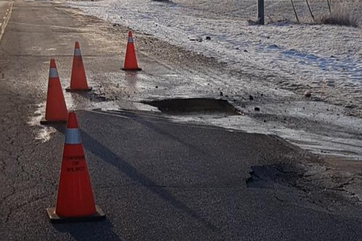 Six cars were damaged passing over this sinkhole, according to police.