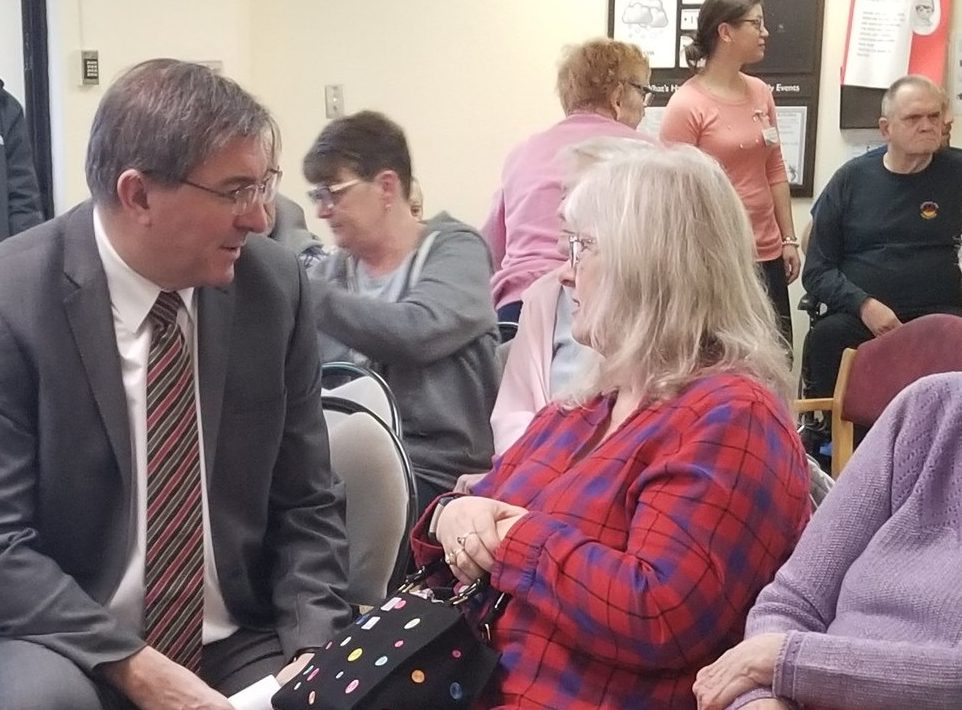 Peterborough-Kawartha MPP Dave Smith speaks to a resident at Riverview Manor on Tuesday. Smith announced new beds and redevelopment of existing beds for the facility.