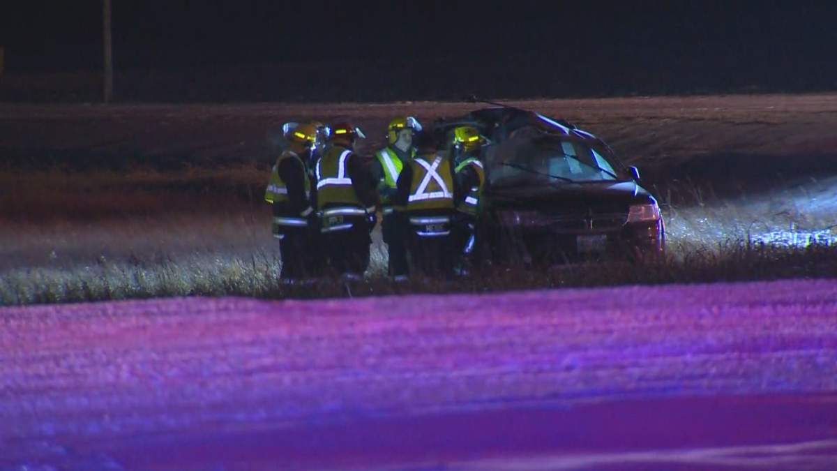 Crews inspect a vehicle involved in a crash on the South Perimeter at Symington Road Friday night.